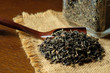 © Chasou_pics - 紅茶の茶葉とガラス瓶。tea leaves with a glass jar on a old wooden table