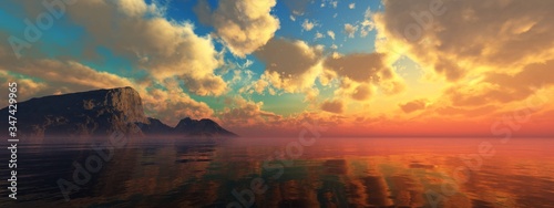 Fotografía Beautiful sea sunset over a rocky island, the sun above the water among the clou