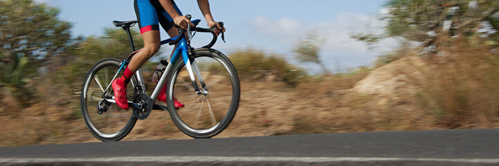 Poster - Road bike cyclist man cycling, athlete on a race cycle. Panning technique used