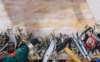 Construction tools on wooden background