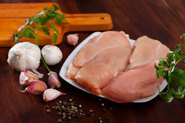 Raw chicken breast on wooden table