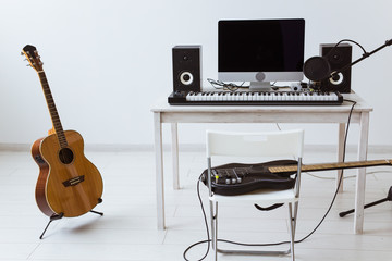 Wall Mural - Synthesizer keyboard digital recording and guitars, home music record studio concept. Leisure and hobby concept.