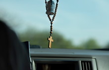 cross necklace in the car