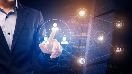 Poster - Businessman touching icon with human on business process hologram