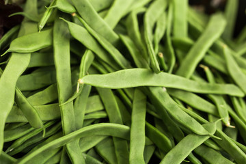 green romano beans on the counter in the market