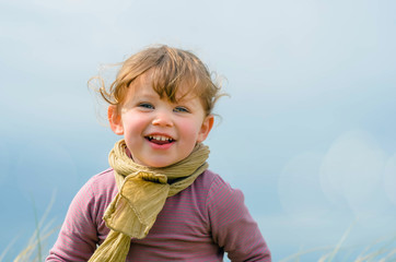 cute little girl enjoying nature in spring