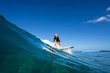© ohrim - young beautiful blonde girl surf on the big waves in the open ocean. Mauritius Island