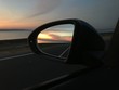 sunset in the car mirror