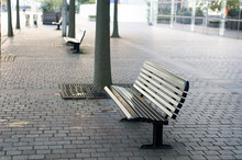 Improvement Of Public Space. Bus Station Place For Waiting. Urban Bench Or Seat. City Bench With Backrest. Rest And Relax. Empty Benches In Street. Quarantine And Pandemic Concept. Vandal Proof Bench