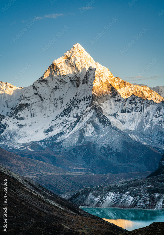 Ama Dablam mountain peak during sunset - obrazy, fototapety, plakaty 