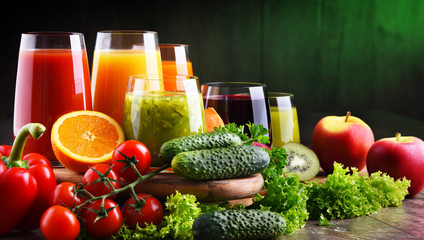 Wall Mural - Glasses with fresh organic vegetable and fruit juices