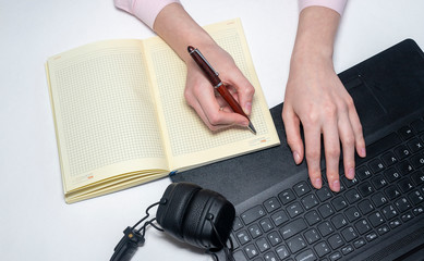 Poster - Laptop documents and hands with a phone on white table. Online business concept