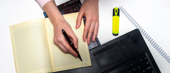 Poster - Laptop documents and hands with a phone on white table. Online business