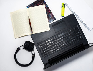 Poster - Laptop documents and notebook with a phone on white table. Online business
