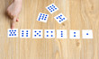 © Nizoli - The child lays out cards with dots according to the number of dots. Learning numbers and math.