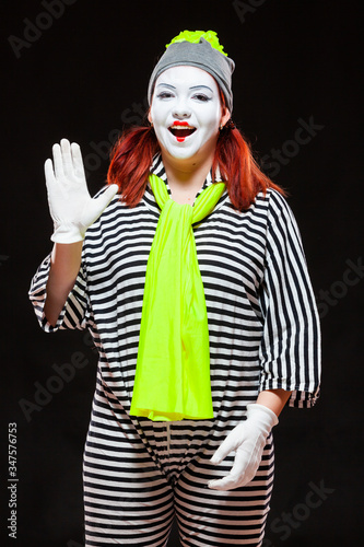 Fotografía Portrait of female mime artist, isolated on black background