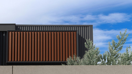 Wall Mural - The back of a new townhouse. Pictured is the second storey showing balcony above garage. The structure is metal clad and there are brown exterior aluminium horizontal louver window coverings. Blue sky