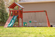 swingset or playground in a home backyard