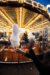 Wall Mural - A cotton candy in front of an ancient German Horse Carousel built in 1896 in Navona Square, Rome, Italy