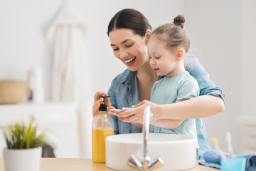 Poster - girl and her mother are washing hands