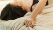 © marchsirawit - Woman hand sign orgasm on bed  , grasping