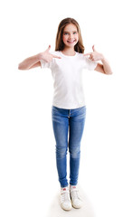 Poster - Portrait of adorable smiling little girl child preteen in the white t-shirt pointing to yourself by forefingers isolated