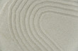 © strigana - Abstract Zen drawing on white sand. Concept of harmony, balance and meditation, spa, massage, relax. Zen garden.