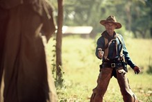Cowboy With Gun Prepares To Gunfight