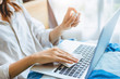 © Quality Stock Arts - People alcohol spray laptop keyboard cleaning for personal hygiene and cleanliness virus protection.