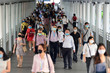 © brostock - Crowd of people wearing surgical mask and walking at Bangkok downtown