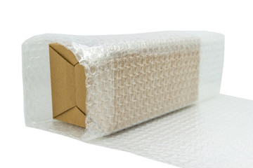 Bubbles covering the box by bubble wrap for protection product cracked white background