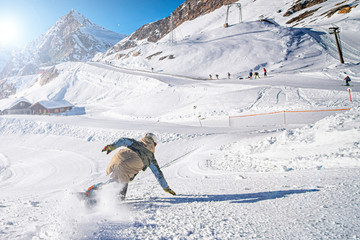 Snowboarder on a slope in the Italian alps