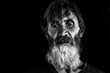 © Srdjan - Dramatic close up black and white portrait of old homeless alcoholic man face with white beard depressed sick and lonely, social issues documentary concept with hard contrast