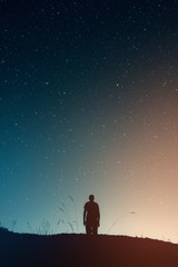 Wall Mural - man silhouette star gazing at night, starry sky astronomy landscape