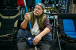 © Nomad_Soul - Angler in rubber boots holds rod in fishing shop