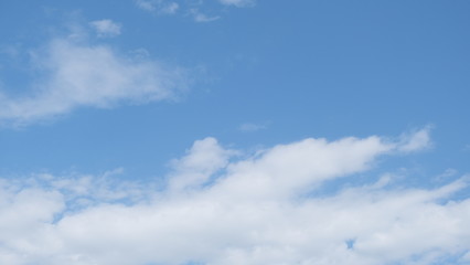 blue sky in clear weather with soft clouds