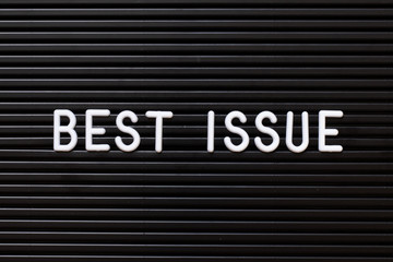 Black color felt letter board with white alphabet in word best issue background