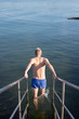 © viktor holm - Man going for a swim in the swedish archipelago