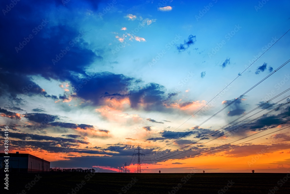 High voltage post . The power transmission towers of sunset sky ...