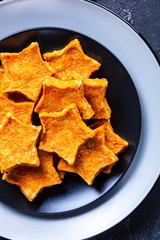 Wall Mural - Carrot Stars cookies on a black plate