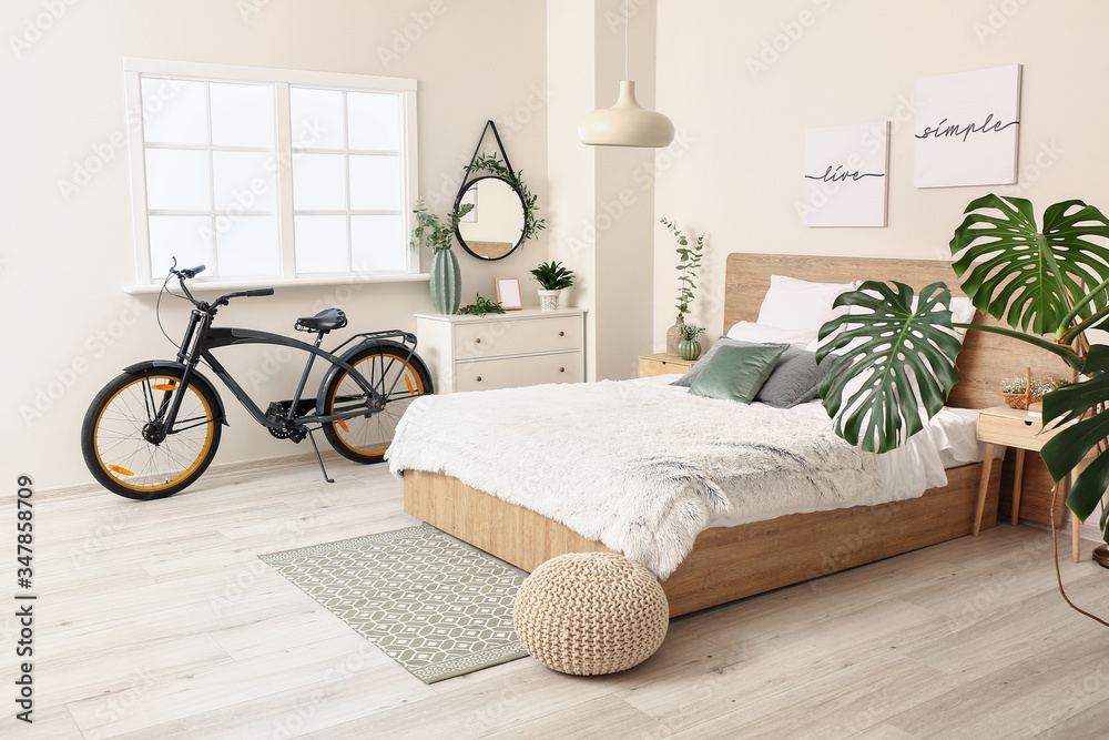 Interior of modern bedroom with bicycle