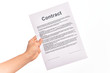 © Krakenimages.com - Holding business contract paper over isolated white background