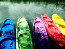 High Angle View Of Colorful Kayaks Moored On Lake
