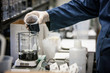 Laboratory Worker Pouring Beaker