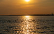 Scenic sunset over the sea. Reflection of the sun in water