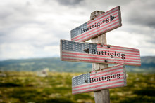 Buttigieg Text On Wooden American Flag Signpost Outdoors In Nature.