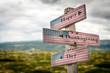 © Jon Anders Wiken - Happy thanksgiving day text on wooden american flag signpost outdoors in nature.