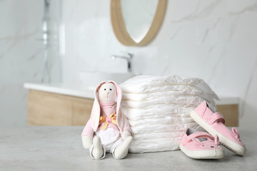 Wall Mural - stack of diapers and baby accessories on counter in bathroom