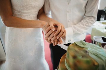 Poster - photo of a bride and a groom cutting a cake