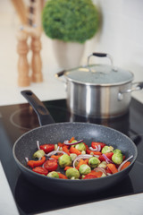 Poster - Vegetables frying in pan on stove. Cooking at home